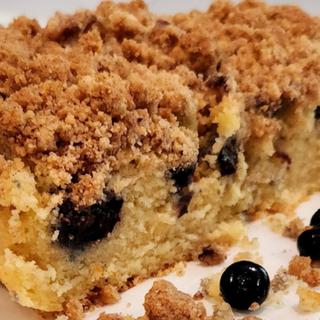 Crumbly Blueberry Breakfast Cake topped with a layer of thick crumble