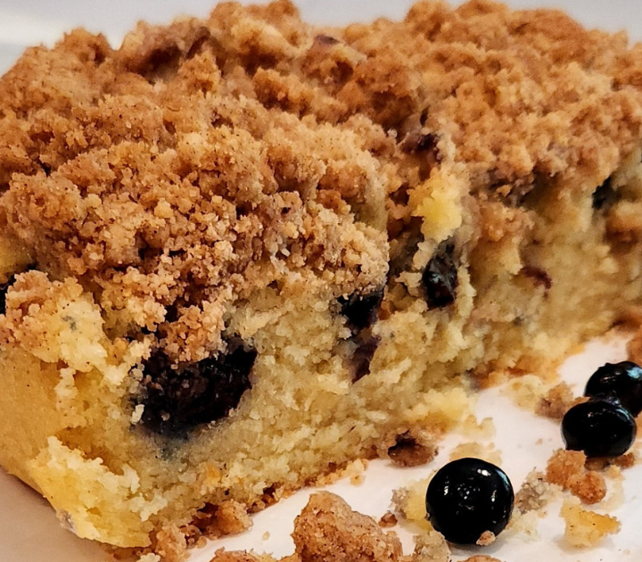 Crumbly Blueberry Breakfast Cake topped with a layer of thick crumble