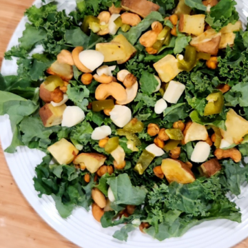 Kale Chickpea Sweet Potato Salad is loaded with crispy kale, roasted chickpeas and sweet potatoes, crunchy cashews and spicy pickled jalepenos