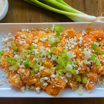 Vegetarian Loaded Buffalo Tots are big on spicy buffalo and blue cheese flavor without the mess and without the meat.