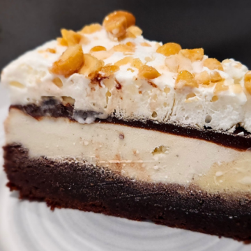 Dreamy Brownie Fudge Ice Cream Cake has layers of brownie, hot fudge, vanilla ice cream, and whipped cream and is topped with salty peanuts wrapped up into a dreamy, fudgy, ice cream treat. You can't stop at one bite! Plus, it only uses 5 ingredients!