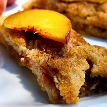Easy Crostata with fresh peaches is made with a crumbly, buttery dough, and filled with ripe juicy peaches that are baked with brown sugar and cinnamon.