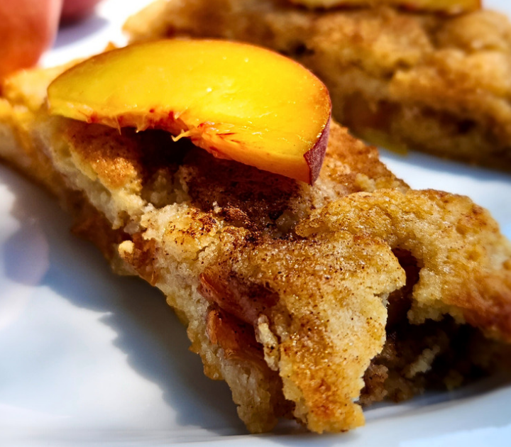 Easy Crostata with fresh peaches is made with a crumbly, buttery dough, and filled with ripe juicy peaches that are baked with brown sugar and cinnamon.