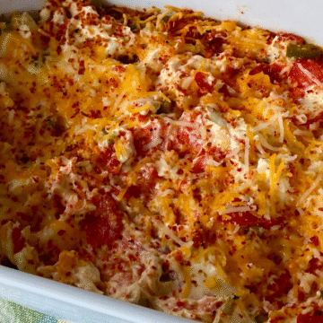 Easy Mexican Cream Cheese Dip pairs fresh cherry tomatoes and jalapeños with Mexican spices and is served over cream cheese to balance the heat