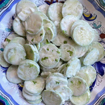 A sprinkle of a fresh herb gives this creamy Summer cucumber salad a fresh flavor.
