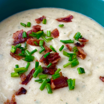 Cheesy ranch potato soup is creamy, extra cheesy potato soup flavored with ranch seasonings and topped with bacon.