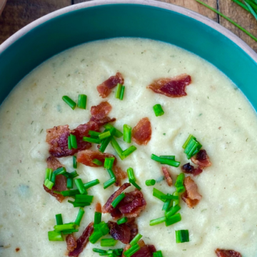 Cheesy ranch potato soup is creamy, extra cheesy potato soup flavored with ranch seasonings and topped with bacon.