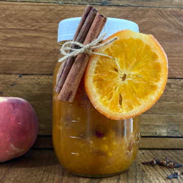 This Orange Peach Jam has a unique flavor thanks to ripe Summer fruit and cinnamon and cloves.