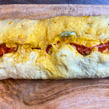 The best chewy french bread with salami, pesto and cheese cooked inside