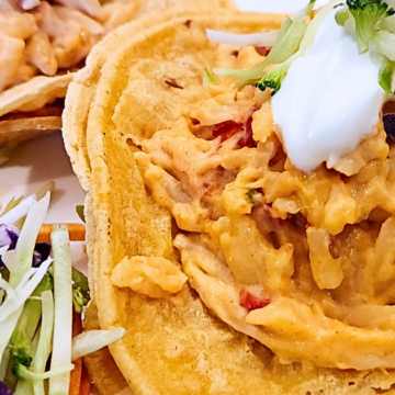 Orzo pasta and shredded chicken in a spicy, creamy, cheesy sauce baked until bubbly and served on warm corn tortillas,