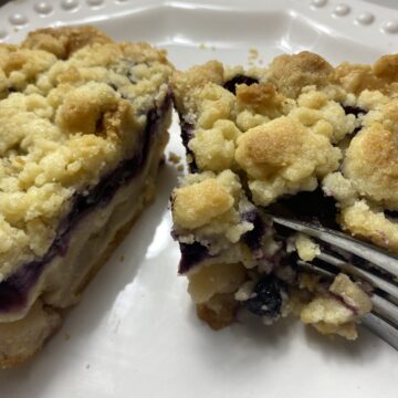 Two layers of pie, bursting with bubbling cinnamon-spiced pears, plump juicy blueberries, a thick crumble topping, and baked until golden brown.