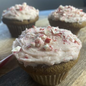 Light, fluffy, full of warm spices and rich molasses, and topped with a peppermint buttercream frosting loaded with candy cane pieces. 