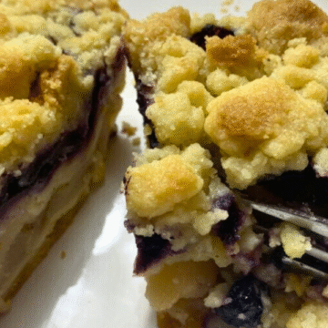 Two layers of pie, bursting with bubbling cinnamon-spiced pears, plump juicy blueberries, a thick crumble topping, and baked until golden brown.