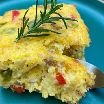 This Make Ahead Christmas Morning Casserole is loaded with cheese, sausage, onions and two types of peppers - red and green - to make your Christmas morning easy and festive!
