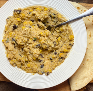 Loaded with black beans, corn, creamy polenta, chicken, and two kinds of cheese, is hearty and satisfying any day of the week.