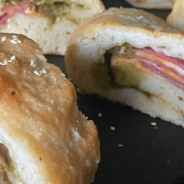 Stuffed with salami, basil pesto, and two kinds of cheese and baked inside a loaf of homemade French bread with a soft pillowy dough and the best crunchy crust.