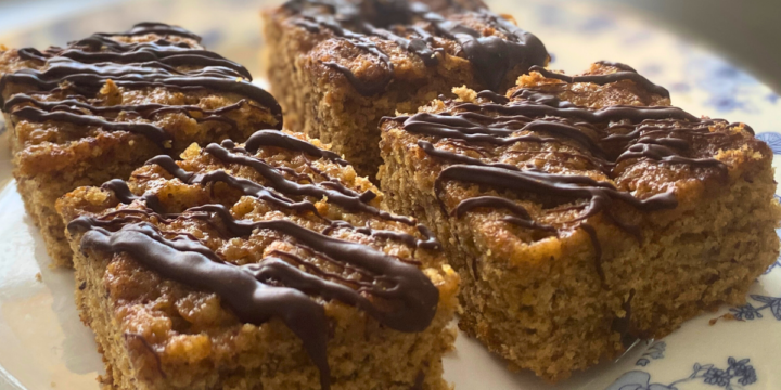 Healthy Banana Applesauce Snacking Cake is light, fluffy, full of bananas, with a light chocolate drizzle.