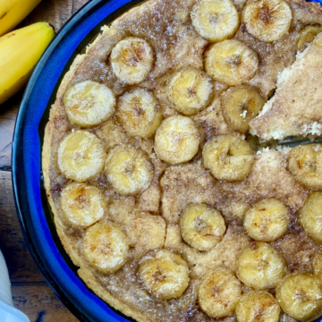 Fresh sliced bananas are caramelized in maple syrup and baked into a Baked Banana Upside Down Pancake big enough to feed the entire family.