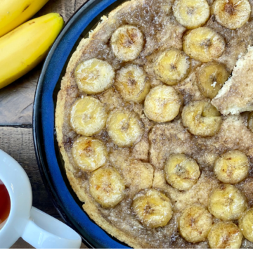 Fresh sliced bananas are caramelized in maple syrup and baked into a Baked Banana Upside Down Pancake big enough to feed the entire family.