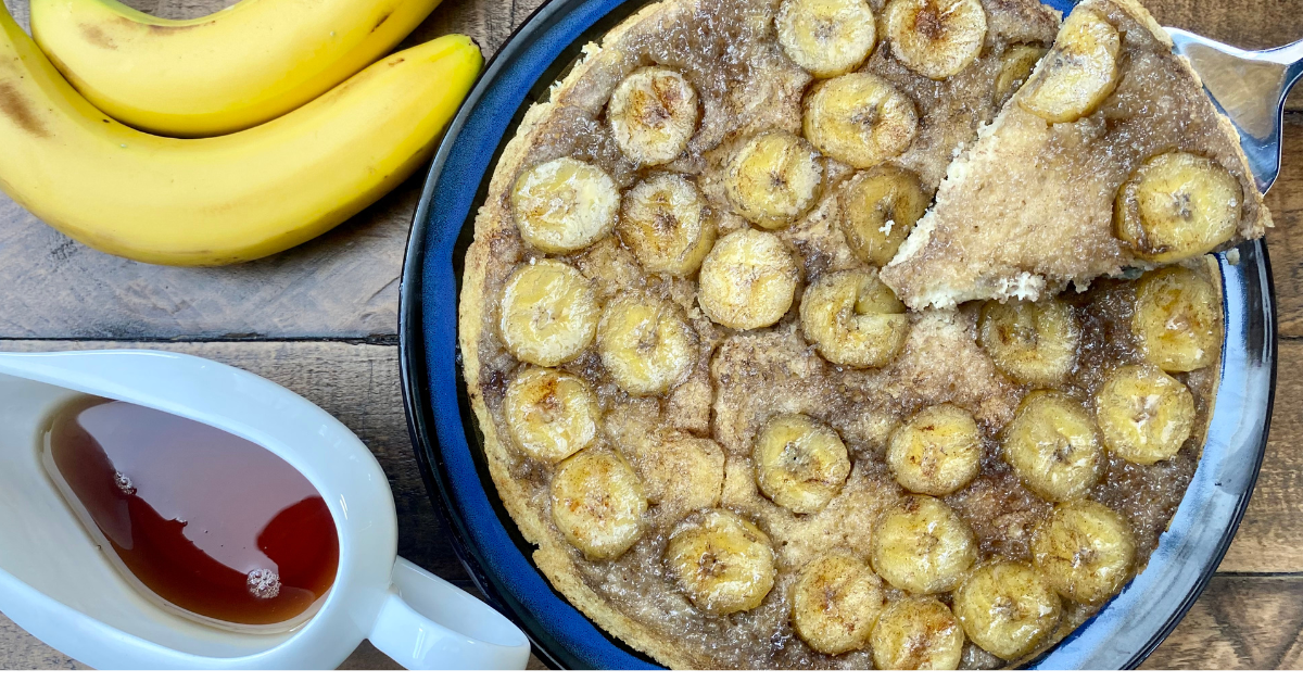Fresh sliced bananas are caramelized in maple syrup and baked into a Baked Banana Upside Down Pancake big enough to feed the entire family.