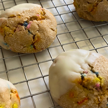 Light and fluffy, packed with rainbow sprinkles and dipped in white chocolate