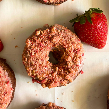 All the flavors and texture of an old-fashioned cake donut loaded with chocolate flavor, dipped in a vanilla glaze, and topped with the most delicious strawberry crunch!