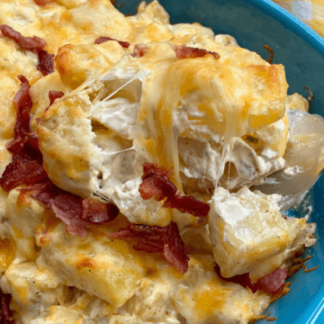 This potato bacon casserole has a creamy bacon sour cream dressing and all of your favorite loaded baked potato topping mixes right in.