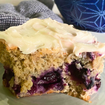 Moist and tender, bursting with juicy blueberries and topped with a creamy vanilla buttercream frosting.