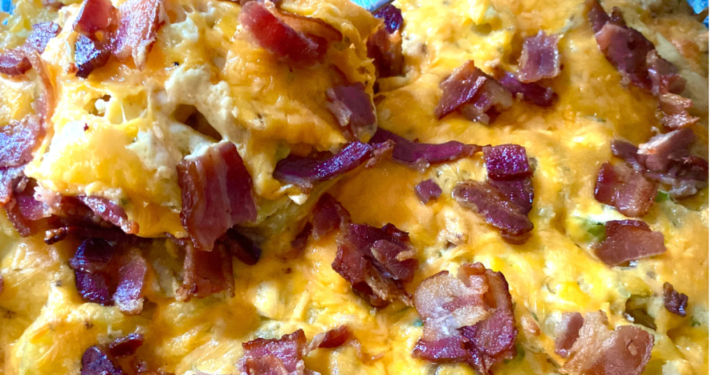 Warm Loaded Baked Potato Salad has a creamy bacon sour cream dressing and all of your favorite loaded baked potato topping mixes right in.