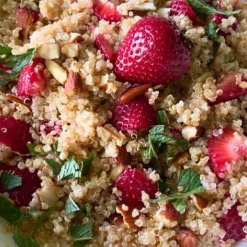 Strawberry Mint Walnut Quinoa is loaded with crunchy quinoa, tender strawberries, salted almonds, and fresh mint tossed in a light honey maple vinaigrette.