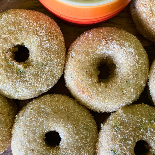 Baked Cinnamon Sugar Zucchini Donuts have a melt-in-your-mouth fluffiness, perfectly balanced by a crispy cinnamon sugar topping that adds sweetness and crunch to every bite.