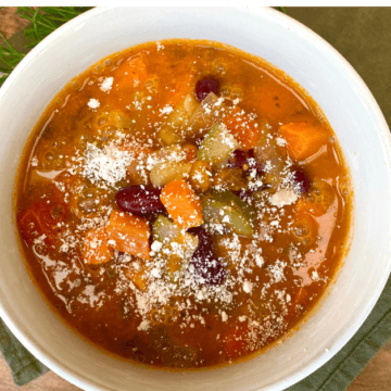 Creamy minestrone soup uses blended white beans to create a filling, healthy soup.