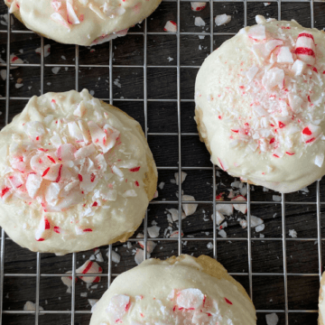 With a buttery, melt-in-your-mouth interior, creamy white-chocolate coating, and a crunch of crushed candy canes, these Candy Cane Tea Cake Cookies are everything you want in a festive peppermint cookie.