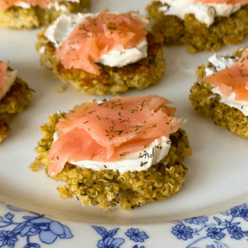 Crispy quinoa patties with velvety cream cheese and rich smoked salmon for a perfectly balanced, flavorful bite.