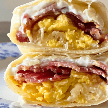 Packed with fluffy scrambled eggs, crispy bacon, tangy pickled jalapeños, and a smooth, velvety layer of cream cheese that melts into the warm tortilla for a rich and creamy bite