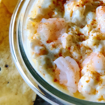 Rich, creamy, and slightly tangy with a savory blend of cheeses, tender shrimp, and marinated artichokes, this has a smooth, gooey texture with a golden, bubbly top.