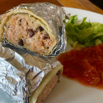 Cheesy bean and rice burritos are stuffed with a cream cheese filling.