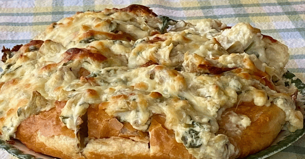 This hot spinach & artichoke spread can be served as a pull-apart bread. 