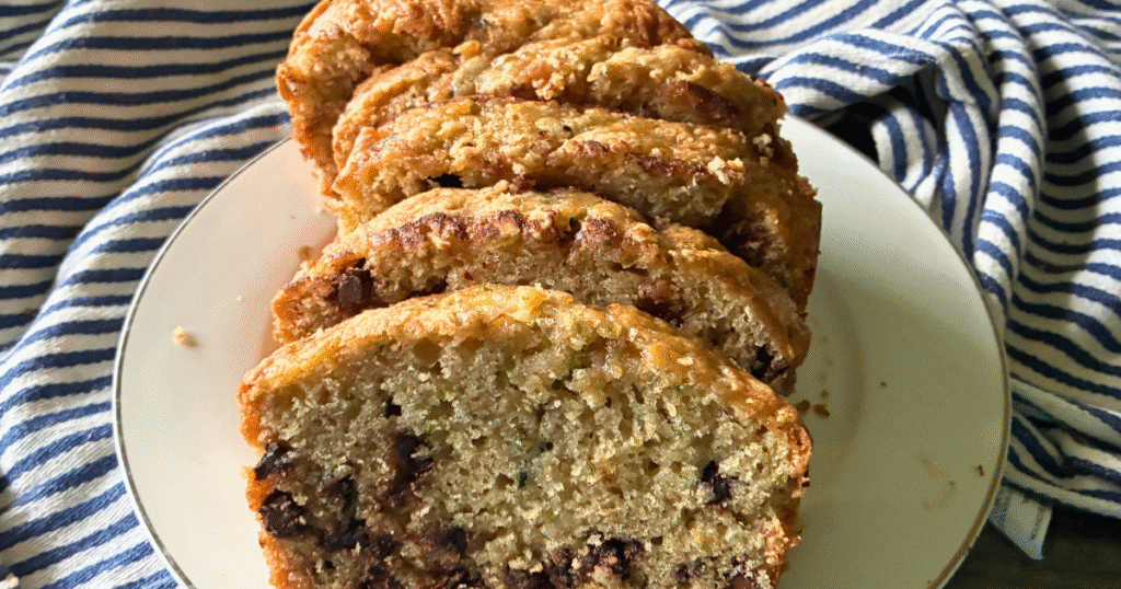 This Simple Zucchini Chocolate Chip Loaf is super moist and fluffy, with a slightly crispy, crackly top, and loaded with chocolate chips!