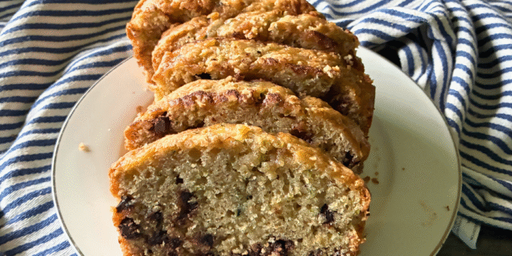 This Simple Zucchini Chocolate Chip Loaf is super moist and fluffy, with a slightly crispy, crackly top, and loaded with chocolate chips!