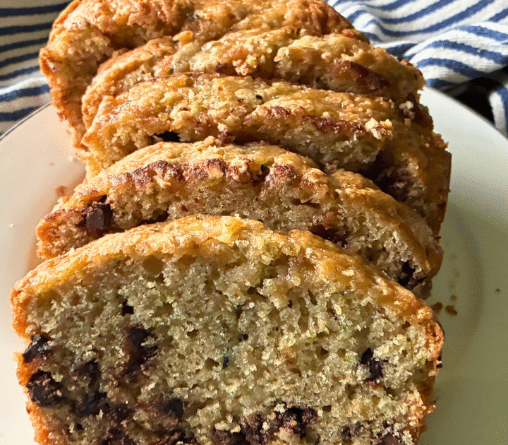 This Simple Zucchini Chocolate Chip Loaf is super moist and fluffy, with a slightly crispy, crackly top, and loaded with chocolate chips!