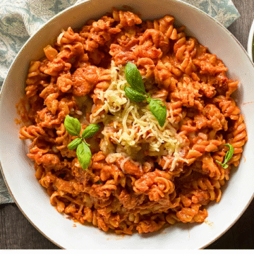 This One Pan Creamy Supreme Pizza Pasta is loaded with smoky Italian sausage, peppers, and tender noodles simmered in a rich, creamy sauce.