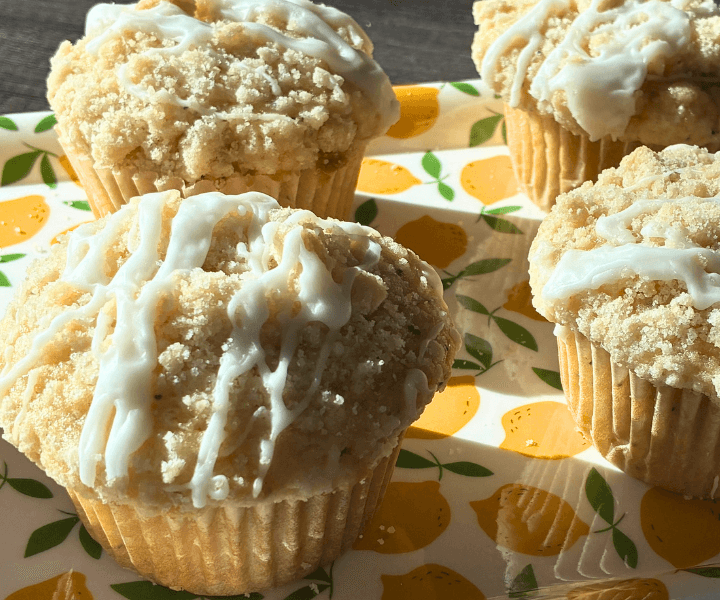These gluten free lemon poppy seed muffins are soft, fluffy, and full of bright lemon flavor in every bite. They have that classic bakery-style look—tall tops, a buttery crumb topping, and a light lemon glaze that pulls everything together.