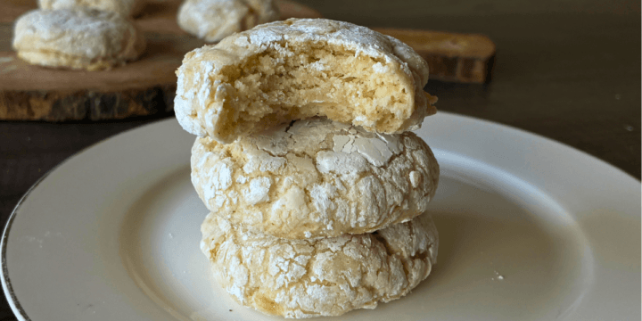 Gooey Banana Butter Cookies (gluten free) are Soft and pillowy with sweet banana pockets and that signature crackly powdered sugar coating. Think banana bread meets a gooey butter cookie—rich, tender, and completely irresistible.