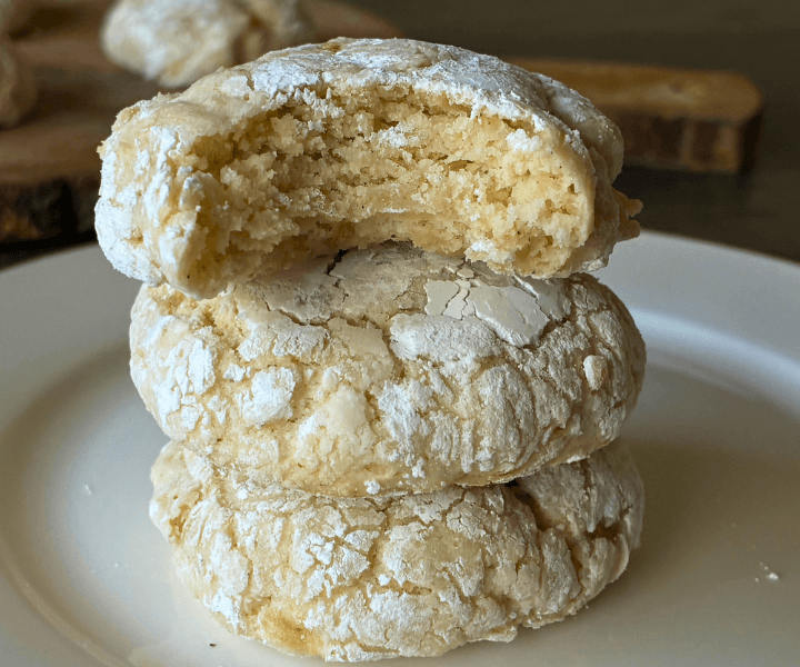 Gooey Banana Butter Cookies (gluten free) are Soft and pillowy with sweet banana pockets and that signature crackly powdered sugar coating. Think banana bread meets a gooey butter cookie—rich, tender, and completely irresistible.