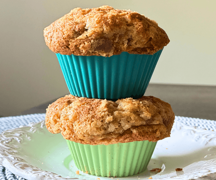 These Gluten Free Banana Chocolate Chip Muffins (Soft & Bakery Style) aren’t like that. They bake up with tall, golden domes, soft fluffy centers, and just enough chocolate to make them feel a little indulgent. The tops are finished with a simple cinnamon sugar layer that melts slightly into the surface, giving a light, caramelized finish without a heavy crumb topping