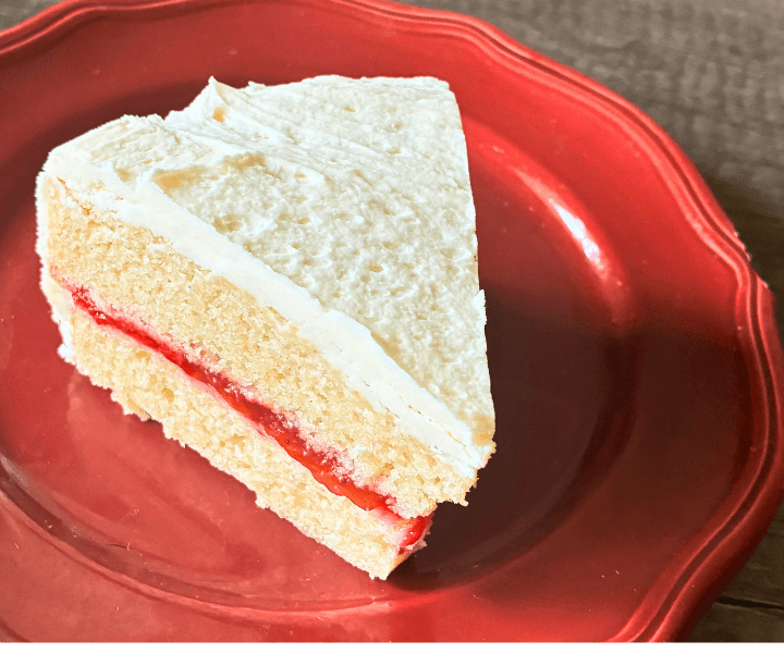 Fresh Strawberry Vanilla Layer Cake is a soft, buttery vanilla cake layered with a sweet homemade strawberry filling and finished with rich vanilla buttercream.
