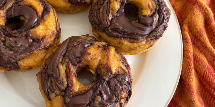These Easy Baked Nutella Swirl Pumpkin Donuts are soft, moist, and packed with warm pumpkin spices and rich chocolate hazelnut swirls. They're baked instead of fried, have a tender, cake-like texture, and take just 15 minutes to prep. Best of all, you don't need a mixer!
