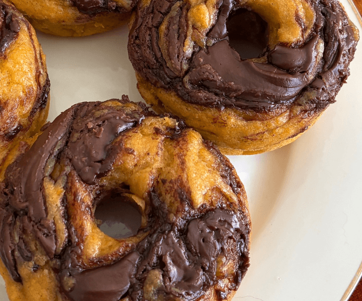 These Easy Baked Nutella Swirl Pumpkin Donuts are soft, moist, and packed with warm pumpkin spices and rich chocolate hazelnut swirls. They're baked instead of fried, have a tender, cake-like texture, and take just 15 minutes to prep. Best of all, you don't need a mixer!